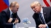 Президент Дональд Трамп (справа) встречается с президентом России Владимиром Путиным в Гамбурге, 7 июля 2017 года, фото AP